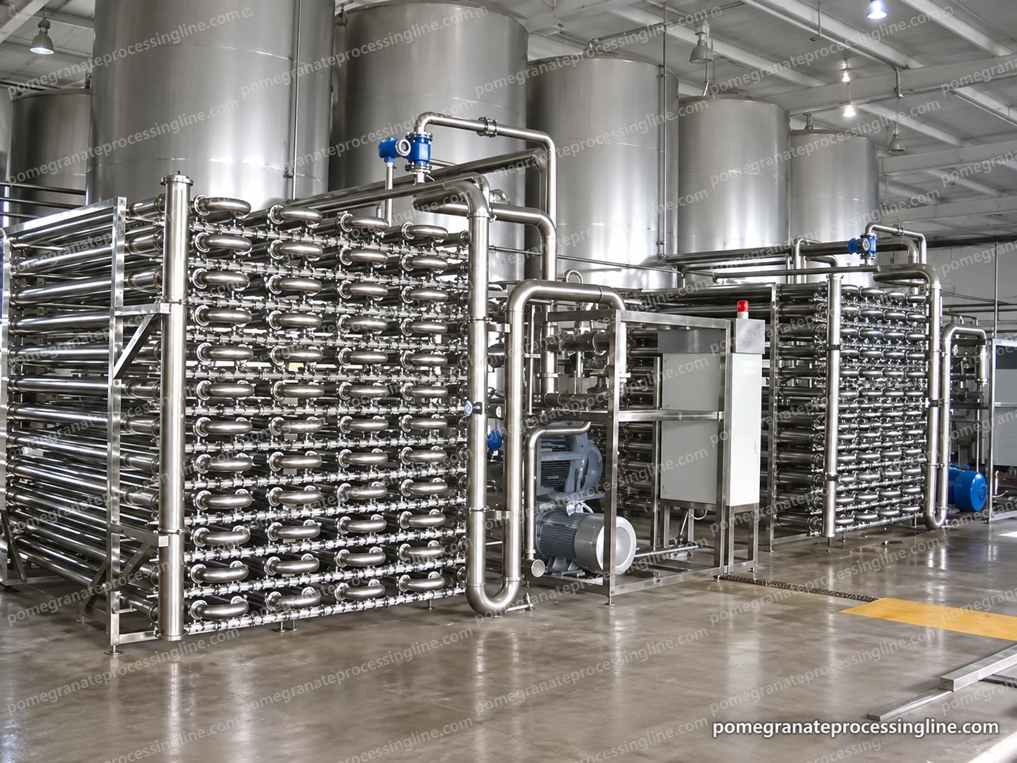 Two arrays of horizontal tubular membrane housings connected by return bends, headers and pump pipework